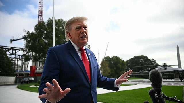 President Trump speaks to members of the press before boarding Marine One on the South Lawn of the White House on Oct. 16, 2026. 