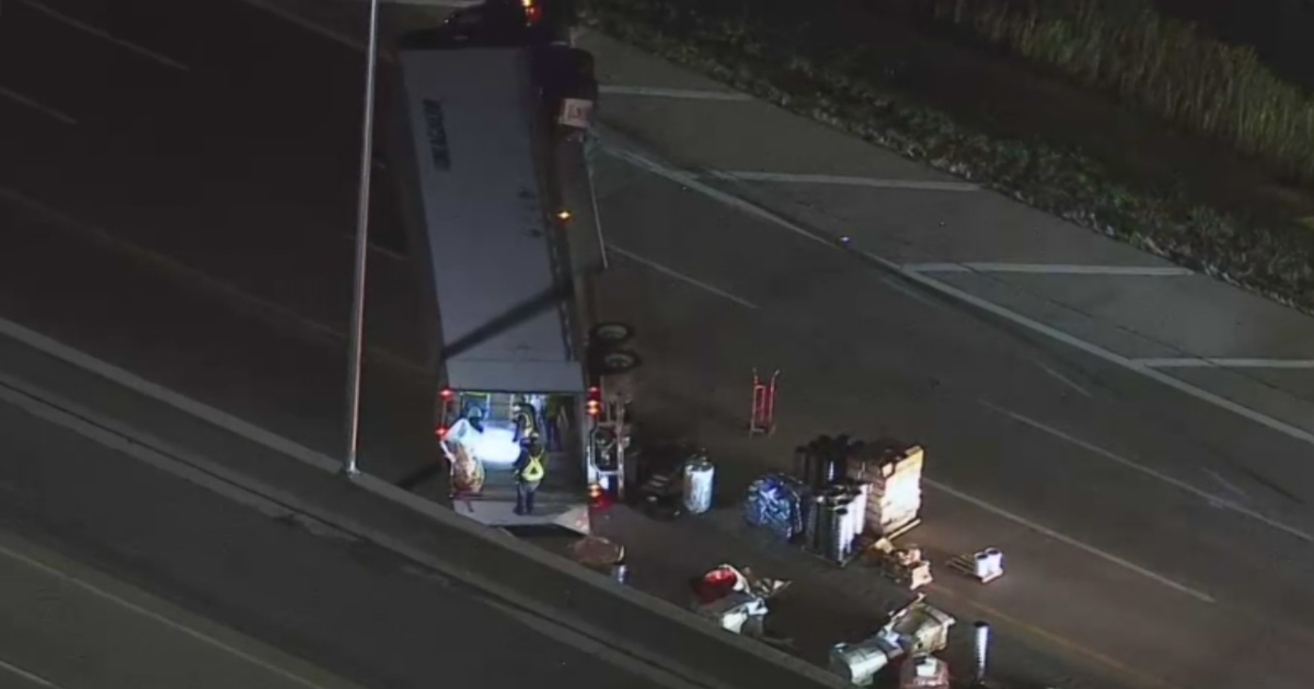 Semi truck carrying hydrochloric acid rolls over on I-90 prompting hazmat response in McHenry County