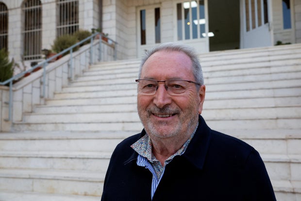 Bernard Baudoux, mayor of Aulnoye-Aymeries, poses for a photograph after he was attacked by militant Israeli settlers