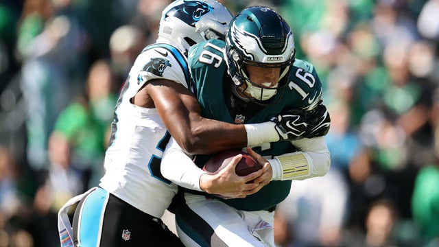 Bobby Okereke #58 of the Carolina Panthers sacks Tanner McKee #16 of the Philadelphia Eagles 
