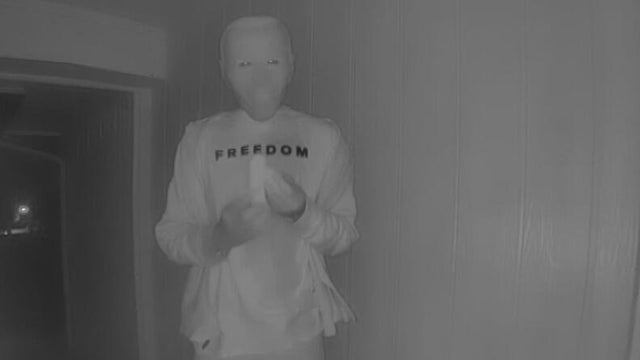 Masked Biden look-alike eats banana in odd Watauga doorstep encounter