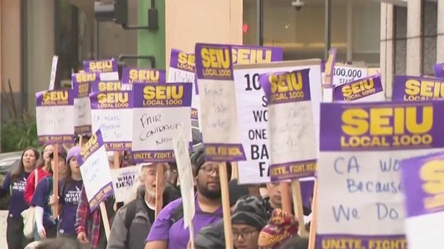Tens of thousands of California state workers stage one-day strike