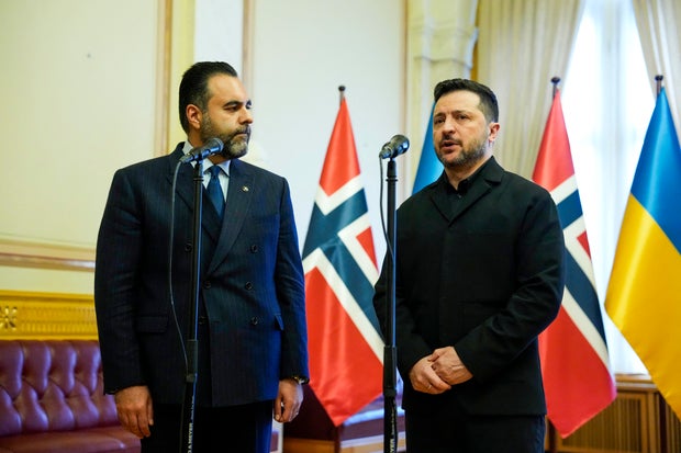 Ukrainian President Volodymyr Zelenskyy, right, and Masud Gharahkhani, the president of Norway's Parliament, speak to journalists on Oct. 21, 2026, in Oslo. 