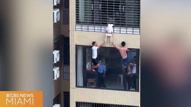 Video shows 3-year-old dangling from 12th-floor window in China