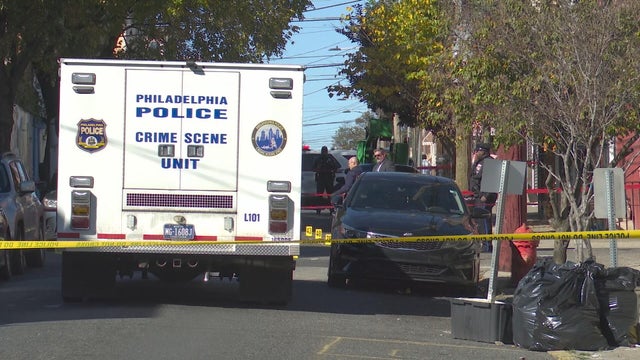 A police crime scene unit vehicle and caution tape are seen near the site of a shooting in Philadelphia's Fairhill neighborhood 