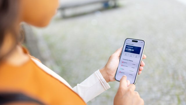 Woman checking her financial accounts on a smartphone 