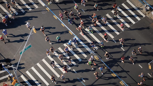 An aerial view of runners crossing 89th Street at First Avenue during the 2025 New York City Marathon on November 2, 2025 in New York City. 