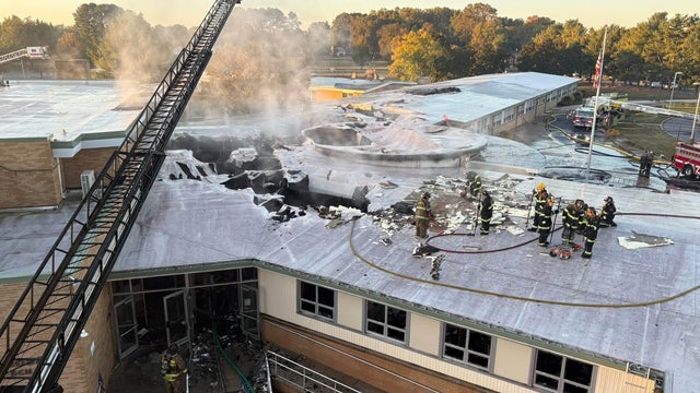 Firefighters on the roof of Lulu Ross Elementary in Milford 