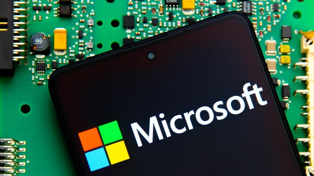 In this photo illustration, the Microsoft logo is seen 