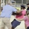 Image from CBS News's coverage: Parents get violent at girls' softball game in Texas, ending in hospitalization, criminal charges