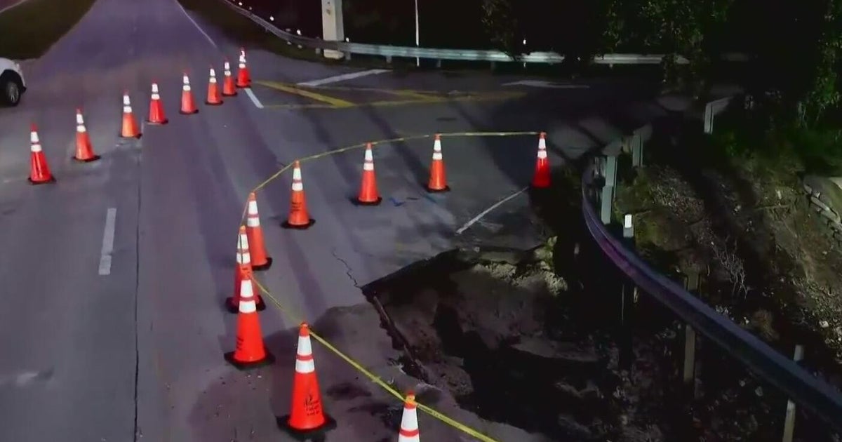 Davie road collapses after water main break, police say – CBS News