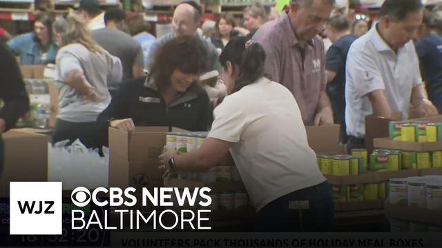 Volunteers pack thousands of holiday meal boxes for families at the Maryland Food Bank