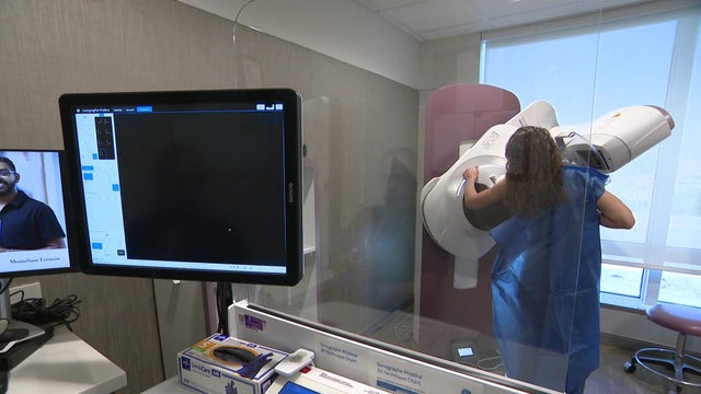 A woman gets a mammogram 