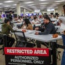 Workers prepare ballots to be scanned for counting at the Orange County Registrar of Voters facility in Santa Ana, California, on Oct. 28, 2026. 