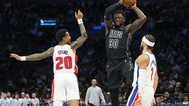 Brooklyn Nets forward Julius Randle (30) looks to pass the ball around Detroit Pistons forward John Collins (20) and guard Cade Cunningham, right, during the second half of an NBA Cup basketball game, Friday, Oct. 30, 2026, in New York. 