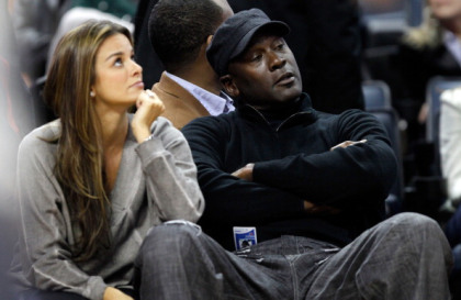 Michael Jordan sits beside fiance, Yvette Prieto during a game between the Chicago Bulls and the Charlotte Bobcats at Time Warner Cable Arena. (Photo by Streeter Lecka/Getty Images)