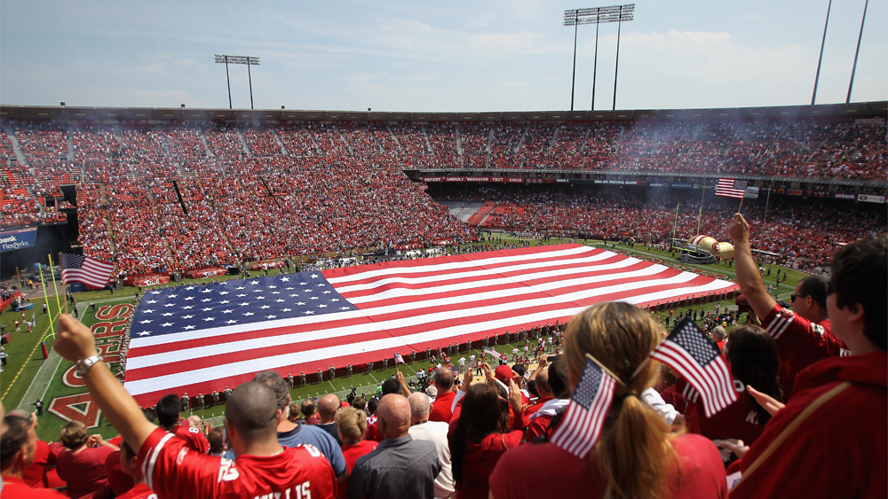 A giant American flag is spread across the field during the singing of the National Anthem before the San Francisco 49ers' season opener against the Seattle Seahawks at Candlestick Park on September 11, 2011 in San Francisco, California.  (Photo by Ezra Shaw/Getty Images)