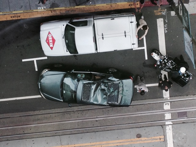 A window washer fell 11 stories from a building near California and Montgomery Streets in San Francisco, and landed on top of the car shown here.