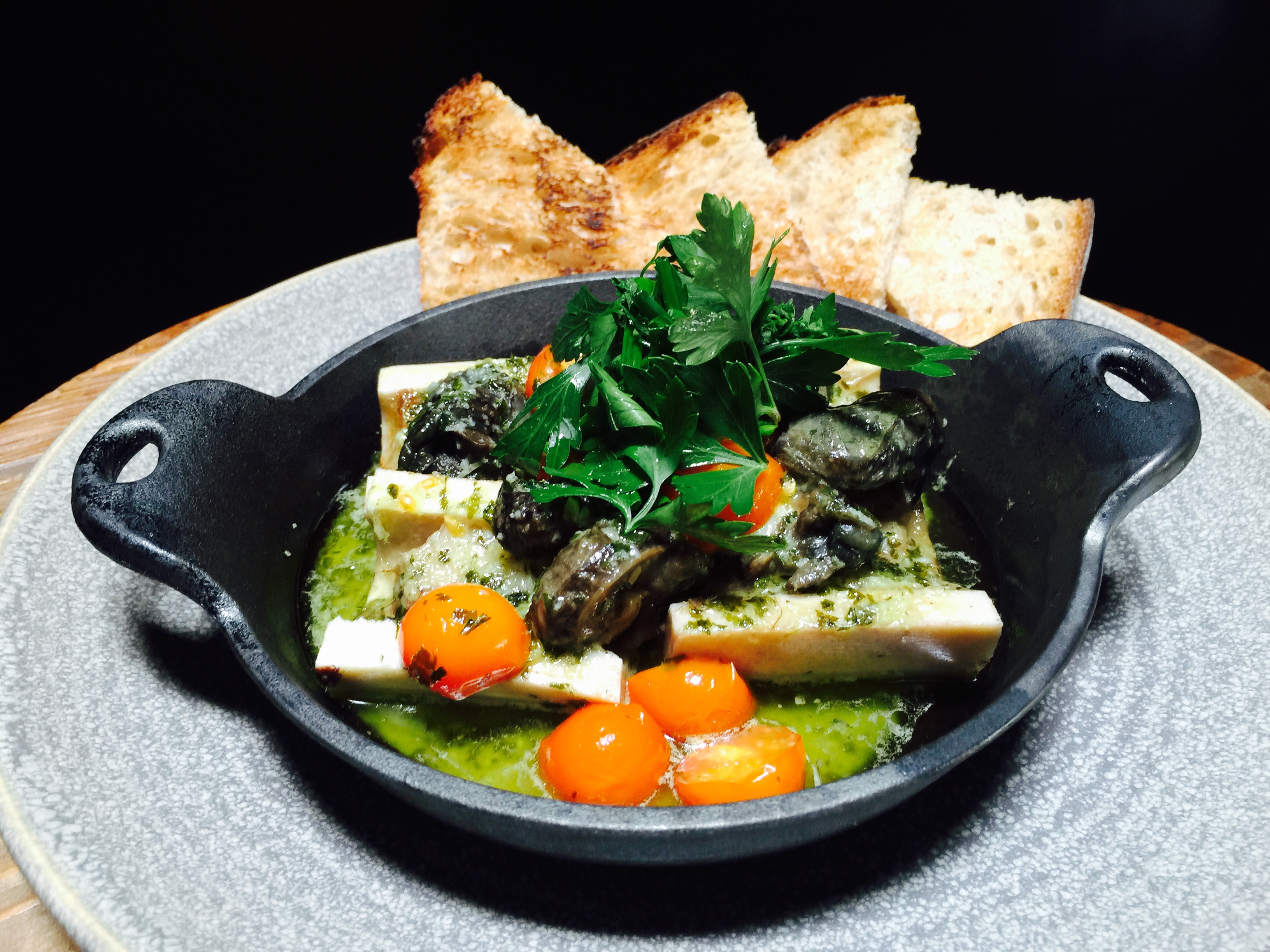 Chef Hiro Sone's Roasted Bone Marrow with Escargot in Burgundy Butter with Herb Salad