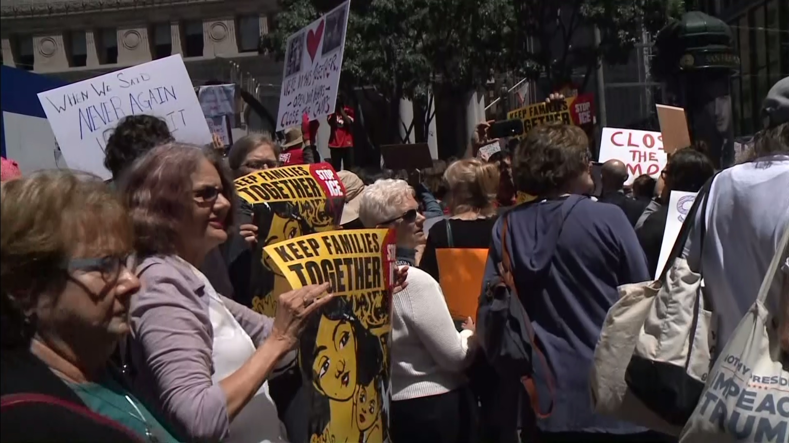 Marchers in San Francisco's Financial District protest detention facilities for migrants, July 2, 2019. (CBS)
