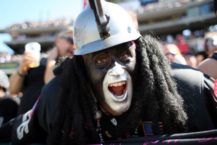 AFC playoffs, Closeup of painted Oakland Raiders fans in Black Hole