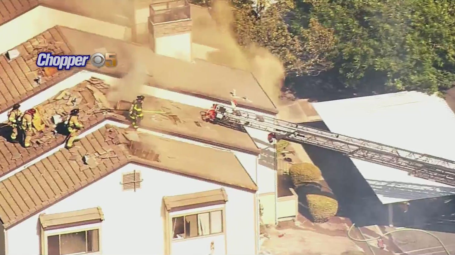 Chopper 5 over the scene as firefighters battle a vegetation fire that spread to apartments in the area of James Donlan Blvd. and Tabora Drive in Antioch on July 21, 2021. (CBS)