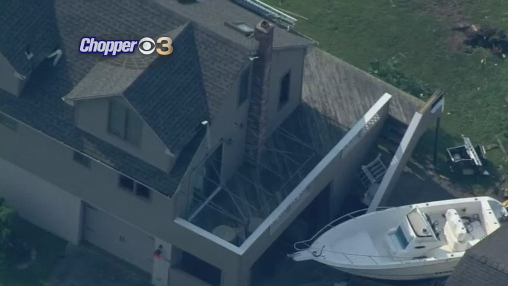 Roofs Torn Off Buildings, Small Boat Found Between Houses Following Storm In Long Beach Island, New Jersey