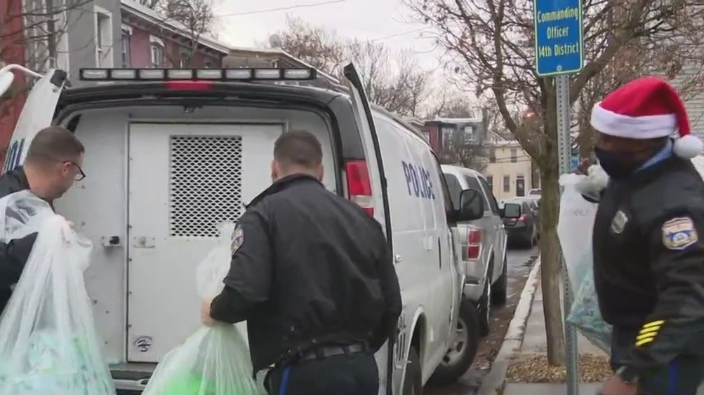 Philadelphia Police Officers Deliver Gifts, Holiday Meals To Families