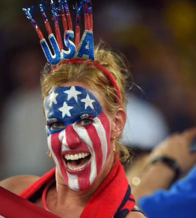 An US fan cheers before a Group G football match between Ghana and US (credit: EMMANUEL DUNAND/AFP/Getty Images)