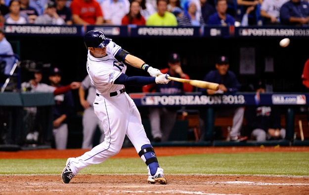 ST PETERSBURG, FL - OCTOBER 07: Evan Longoria #3 of the Tampa Bay Rays flies out to center in the ninth inning against the Boston Red Sox during Game Three of the American League Division Series at Tropicana Field on October 7, 2013 in St Petersburg, Florida.  