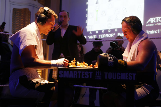 Germany's former world champion Frank Stoldt (L) competes against Belarus' light-heavyweight world champion Leonid Chernobaev (YY) during France's first official chessboxing match on February 1, 2013 at Artcurial auction house in Paris. Chess boxing is a hybrid sport that combines chess with boxing in alternating rounds. The sport was invented by French artist and filmmaker Enki Bilal in one of his comic book in 1992.