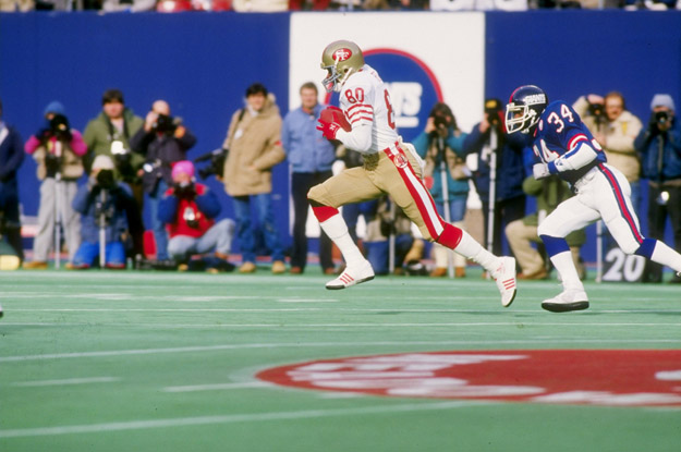 4 Jan 1987: Wide receiver Jerry Rice of the San Francisco 49ers runs down the field during a playoff game against the New York Giants at Giants Stadium in East Rutherford, New Jersey. The Giants won the game 49-3.
