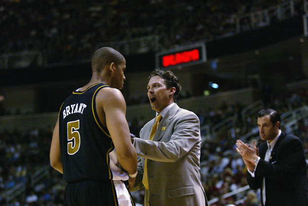 SAN JOSE, CA - MARCH 23:  Head coach Quin Snyder talks to Travon Bryant #5 of the Missouri Tigers during a break in the West Regional Final of the 2002 NCAA Men's Basketball Tournament against the Oklahoma Sooners on March 23, 2002 at Compaq Center in San Jose, California.  The Sooners won 81-75.  