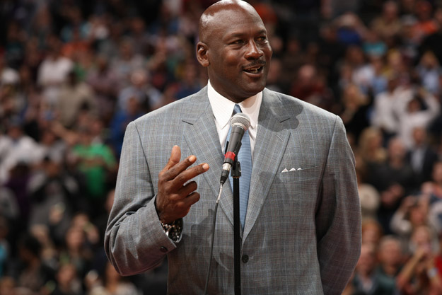 CHARLOTTE, NC - DECEMBER 21:  Michael Jordan, Owner of the Charlotte Bobcats unveils the new Charlotte Hornets logo during the game against the Utah Jazz at the Time Warner Cable Arena on December 21, 2013 in Charlotte, North Carolina.