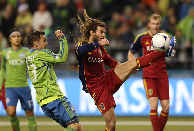SEATTLE, WA - NOVEMBER 02:  Kyle Beckerman #5 of Real Salt Lake battles Christian Tiffert #13 of the Seattle Sounders FC at CenturyLink Field on November 2, 2012 in Seattle, Washington. The Sounders and Real Salt Lake played to a nil-nil tie.  