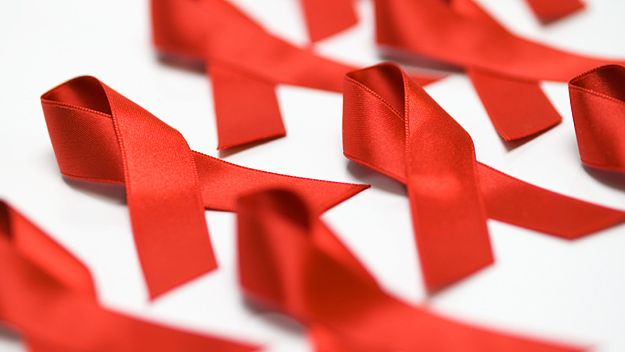 The red ribbon has become an internationally recognized symbol for HIV/AIDS awareness and support for those living with the disease. (Photo credit: Thinkstock)