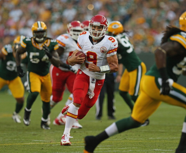 GREEN BAY, WI - AUGUST 30:  Brady Quinn #9 of the Kansas City Chiefs runs for a first down against the Green Bay Packers during a preseason game at Lambeau Field on August 30, 2012 in Green Bay, Wisconsin.  (Photo by Jonathan Daniel/Getty Images)