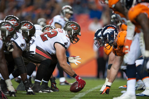 DENVER, CO - DECEMBER 2: Center Ted Larsen #62 of the Tampa Bay Buccaneers lines up against the Denver Broncos defense during a game at Sports Authority Field Field at Mile High on December 2, 2012 in Denver, Colorado. (Photo by Dustin Bradford/Getty Images)