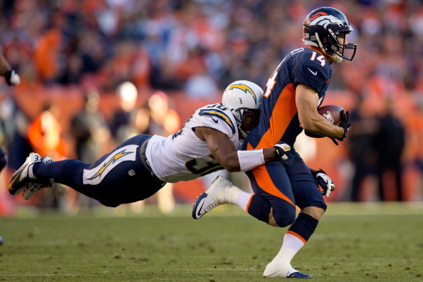 DENVER, CO - NOVEMBER 18: Cornerback Marcus Gilchrist #38 of the San Diego Chargers makes a diving tackle after a reception by wide receiver Brandon Stokley #14 of the Denver Broncos at Sports Authority Field Field at Mile High on November 18, 2012 in Denver, Colorado. (Photo by Justin Edmonds/Getty Images)