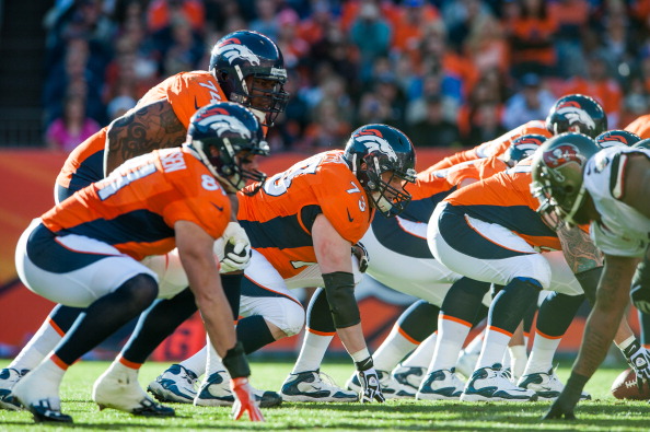 DENVER, CO - DECEMBER 2: The Denver Broncos offensive line, including guard Chris Kuper #73 and tackle Orlando Franklin #74 line up against the Tampa Bay Buccaneers defense during a game at Sports Authority Field at Mile High on December 2, 2012 in Denver, Colorado. (Photo by Dustin Bradford/Getty Images)
