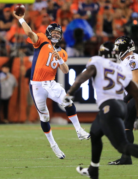 DENVER, CO - SEPTEMBER 5: Peyton Manning #18 of the Denver Broncos throws a pass over Terrell Suggs #55 of the Baltimore Ravens in the third quarter during the game at Sports Authority Field at Mile High on September 5, 2013 in Denver Colorado. (Photo by Doug Pensinger/Getty Images)