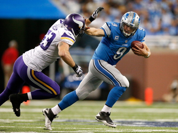 DETROIT, MI - SEPTEMBER 08: Matthew Stafford #9 of the Detroit Lions tries to outrun the tackle of Jared Allen #69 of the Minnesota Vikings during the fourth quarter at Ford Field on September 8, 2013 in Detroit, Michigan. Detroit won the game 34-24. (Photo by Gregory Shamus/Getty Images)