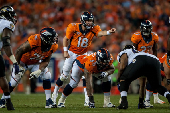 DENVER, CO - SEPTEMBER 5: Quarterback Peyton Manning #18 of the Denver Broncos audibles at the line of scrimmage against the Baltimore Ravens during the game at Sports Authority Field at Mile High on September 5, 2013 in Denver Colorado. (Photo by Dustin Bradford/Getty Images)