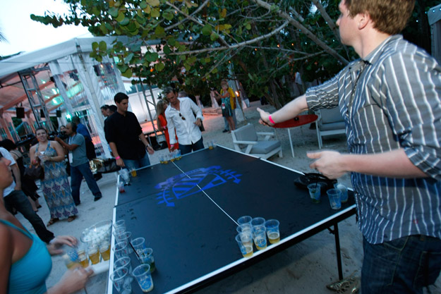 MIAMI - JULY 17: Guests play beer pong at the official kickoff party for Mercedes-Benz Fashion Week Swim at the Raleigh Hotel on July 17, 2008 in Miami, Florida.