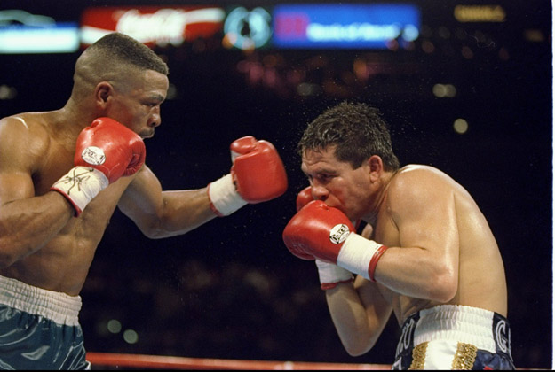 rankie Randall (left) trades blows with his opponent  Julio Cesar Chavez