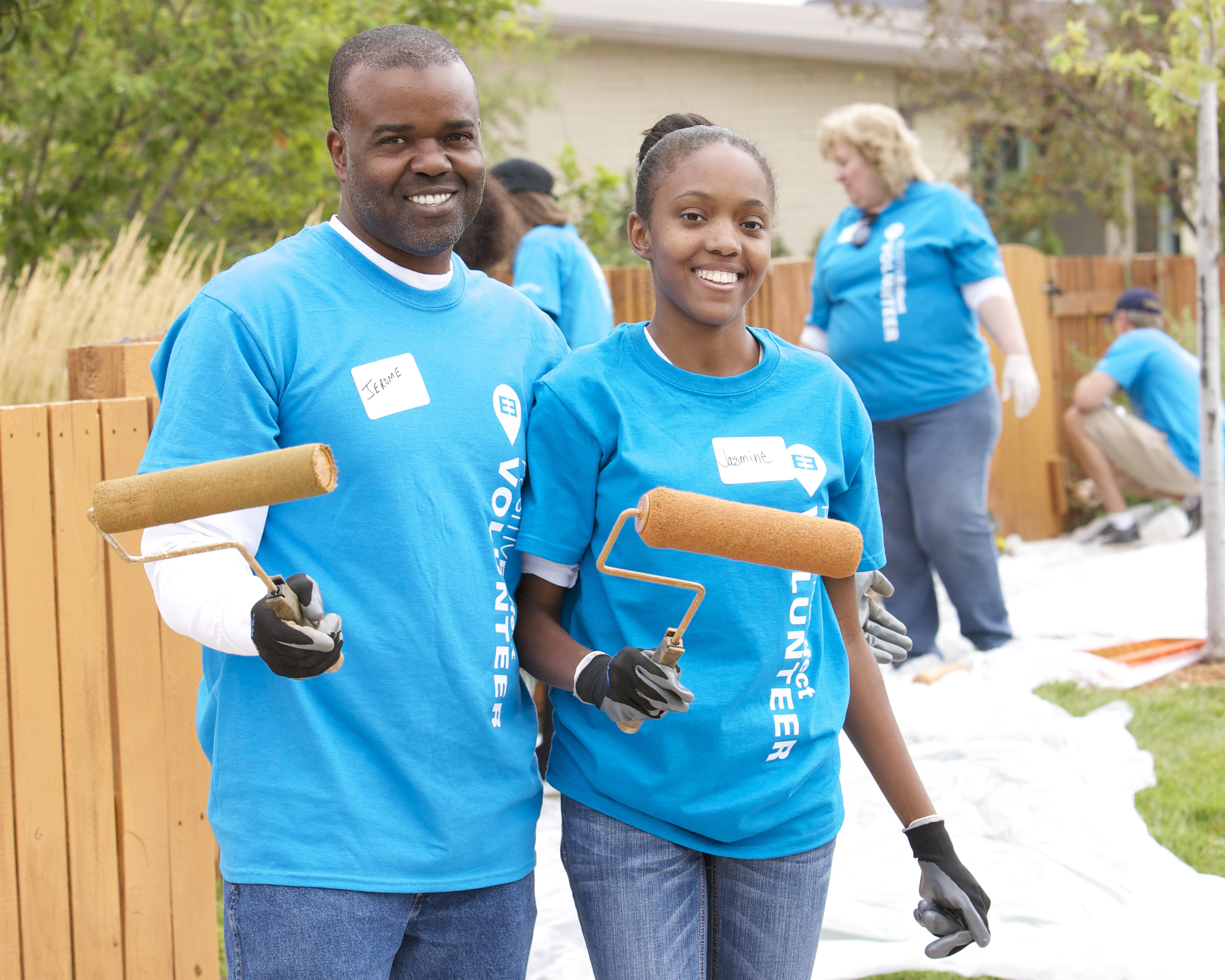 Jerome Davis, of Xcel Energy with a family member during Day of Service (credit: CBS)