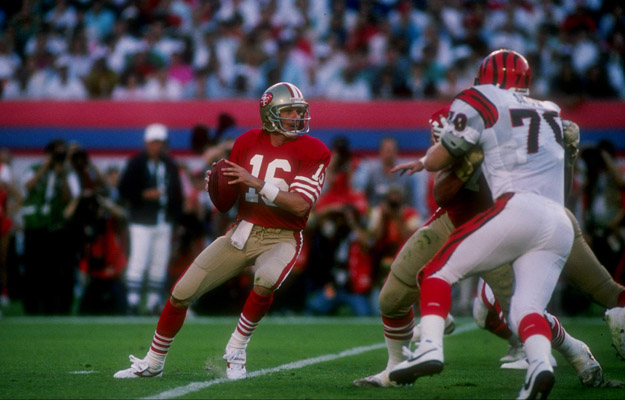 22 Jan 1989:  Quarterback Joe Montana of the San Francisco 49ers looks to pass the ball during Super Bowl XXIII against the Cincinnati Bengals at Joe Robbie Stadium in Miami, Florida.  The 49ers won the game, 20-16.