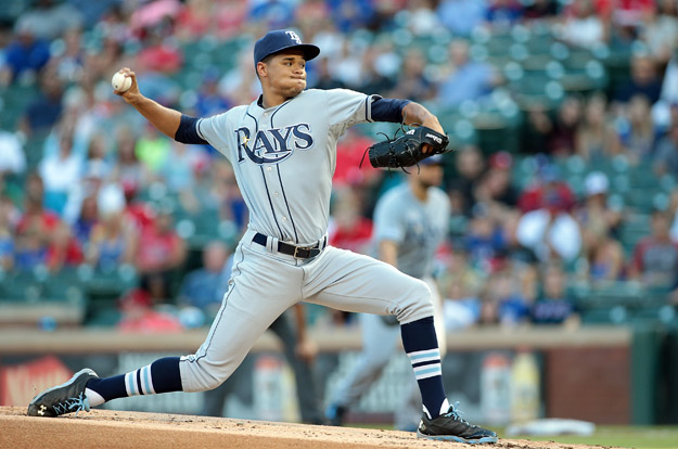 ARLINGTON, TX - AUGUST 13: Chris Archer #22 of the Tampa Bay Rays throws in the first inning against the Texas Rangers at Globe Life Park in Arlington on August 13, 2014 in Arlington, Texas.
