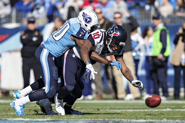 NASHVILLE, TN - DECEMBER 29:  Alterraun Verner #20 of the Tennessee Titans knocks the pass out of the hands of DeAndre Hopkins #10 of the Houston Texans at LP Field on December 29, 2013 in Nashville, Tennessee.  The Titans defeated the Texans 16-10.  