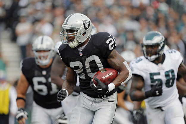 OAKLAND, CA - NOVEMBER 03:  Running back Darren McFadden #20 of the Oakland Raiders carries the ball for 5 yards against the Philadelphia Eagles in the second quarter on November 3, 2013 at O.co Coliseum in Oakland, California.  The Eagles won 49-20. 